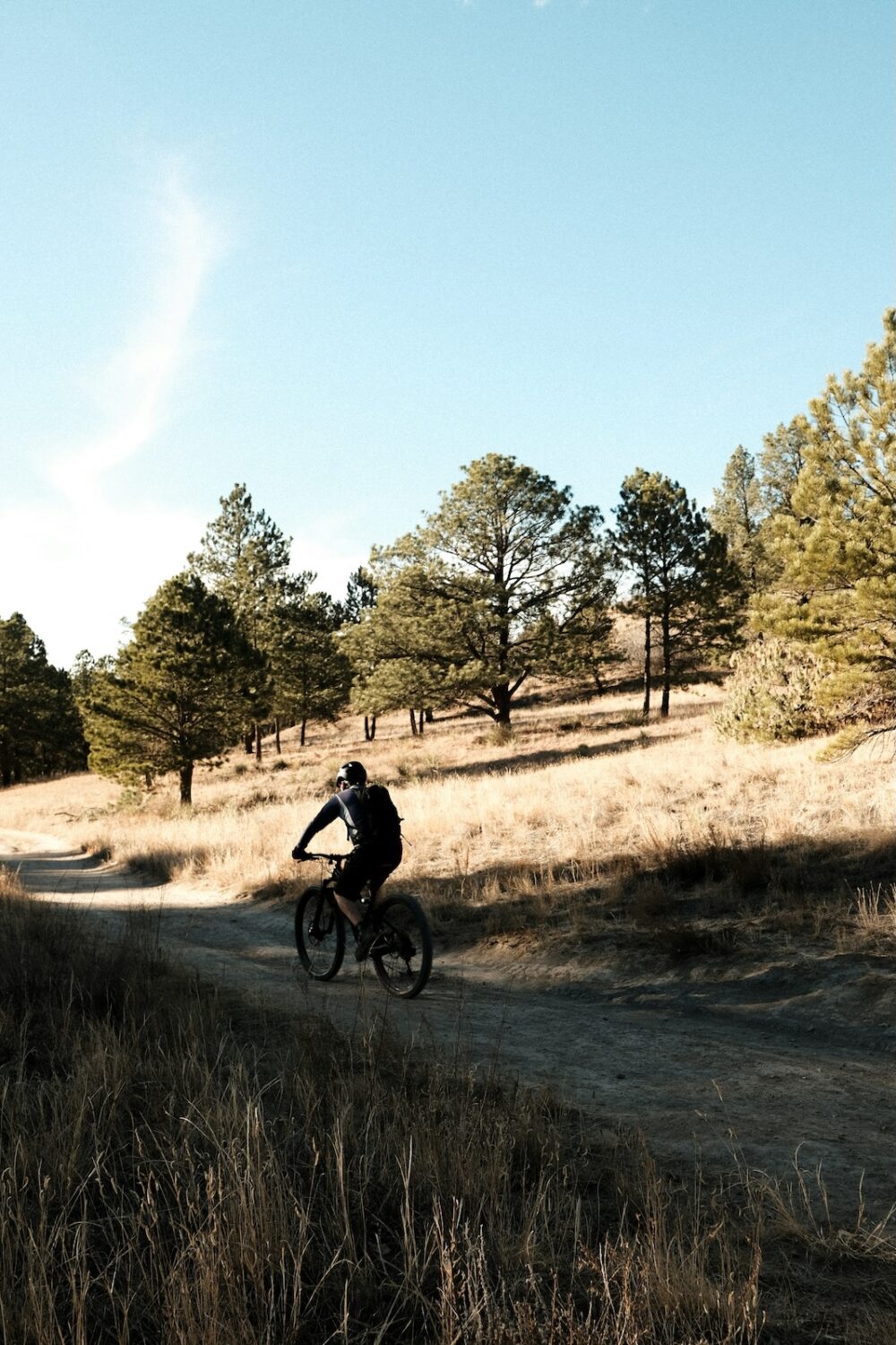 A man biking through the trails.
